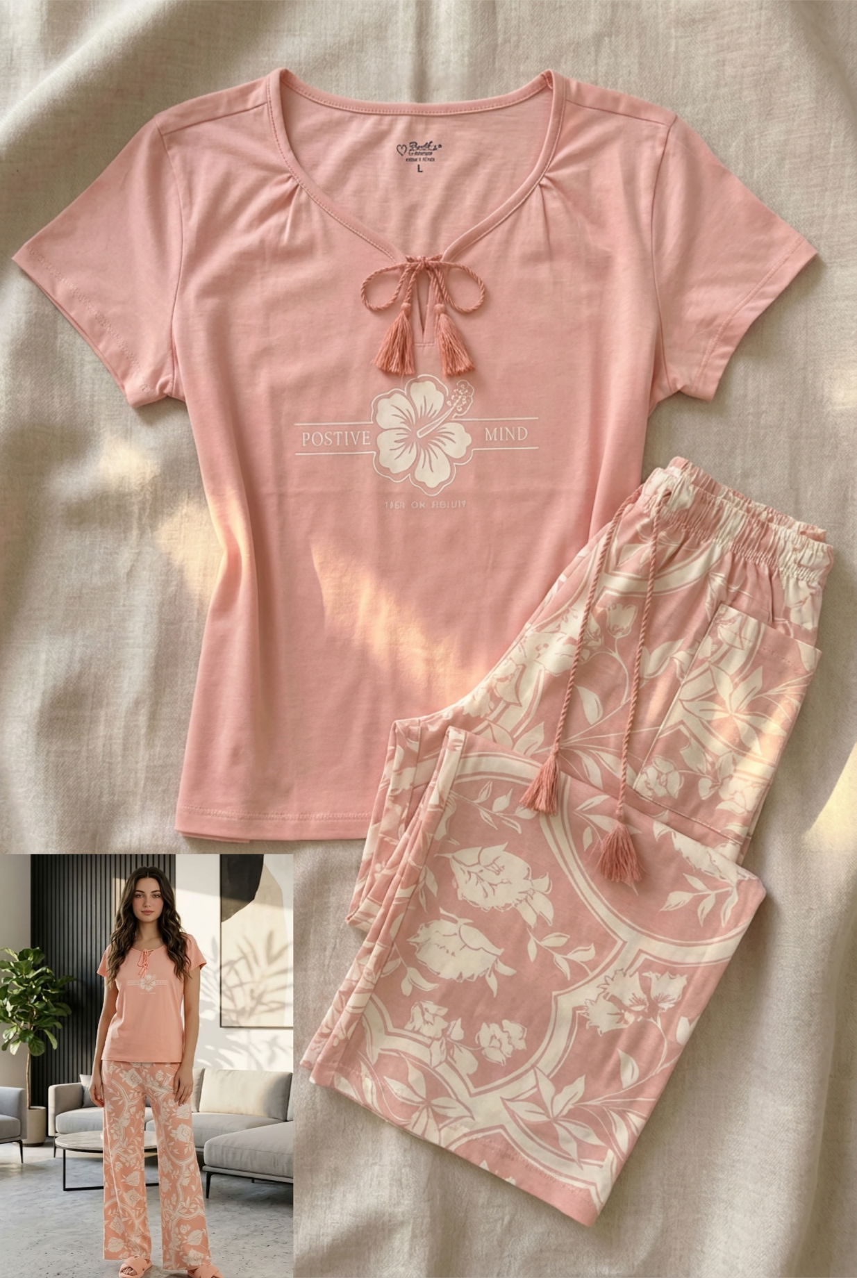 Pink pajama set with floral patterns on a textured surface