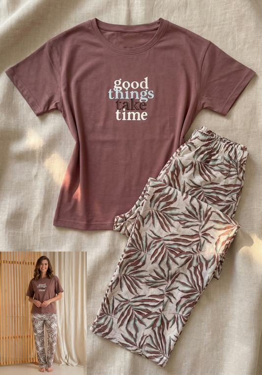 Mauve t-shirt with 'good things take time' text and matching pajama pants on a neutral background.